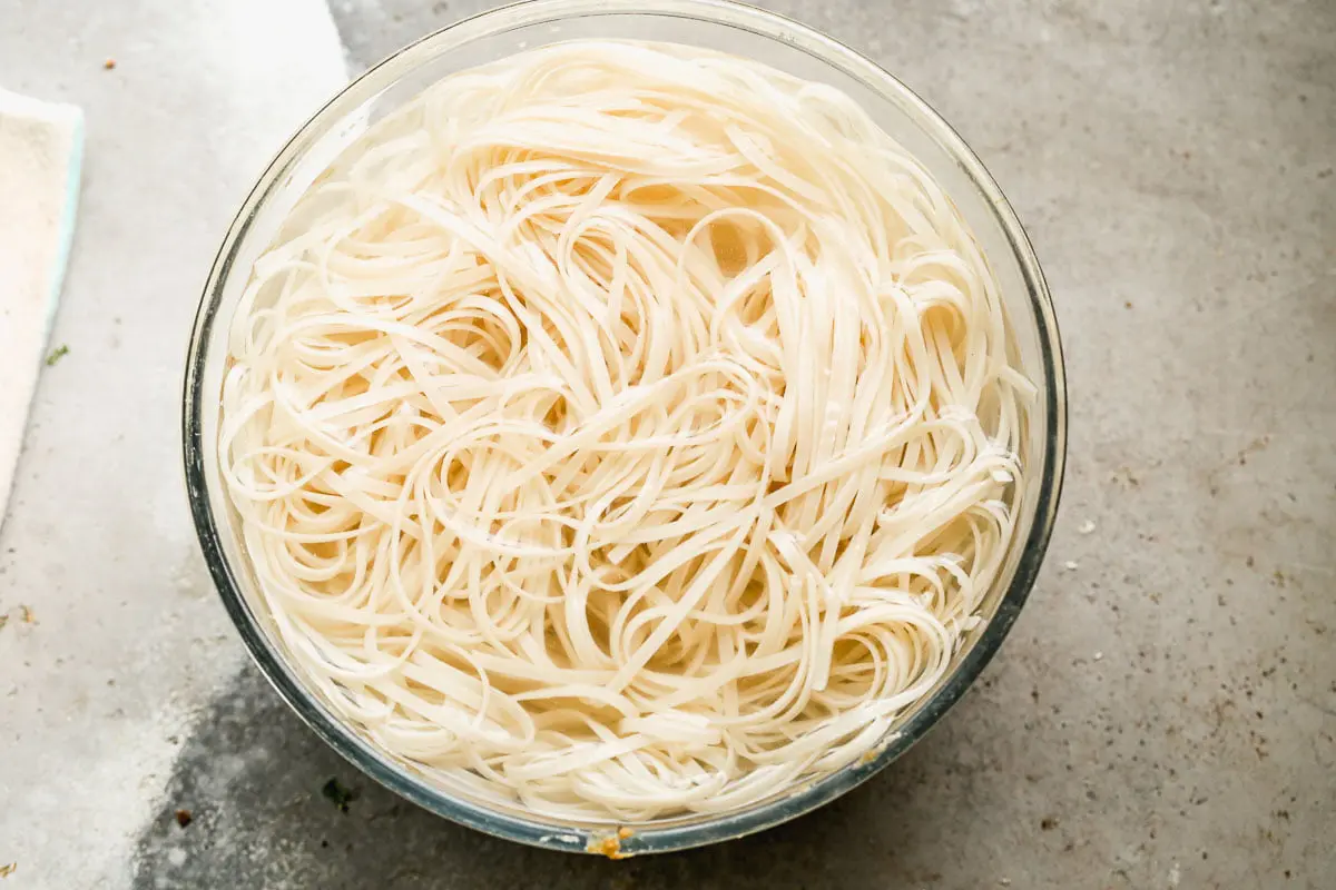 Rice noodles soaking in water. 