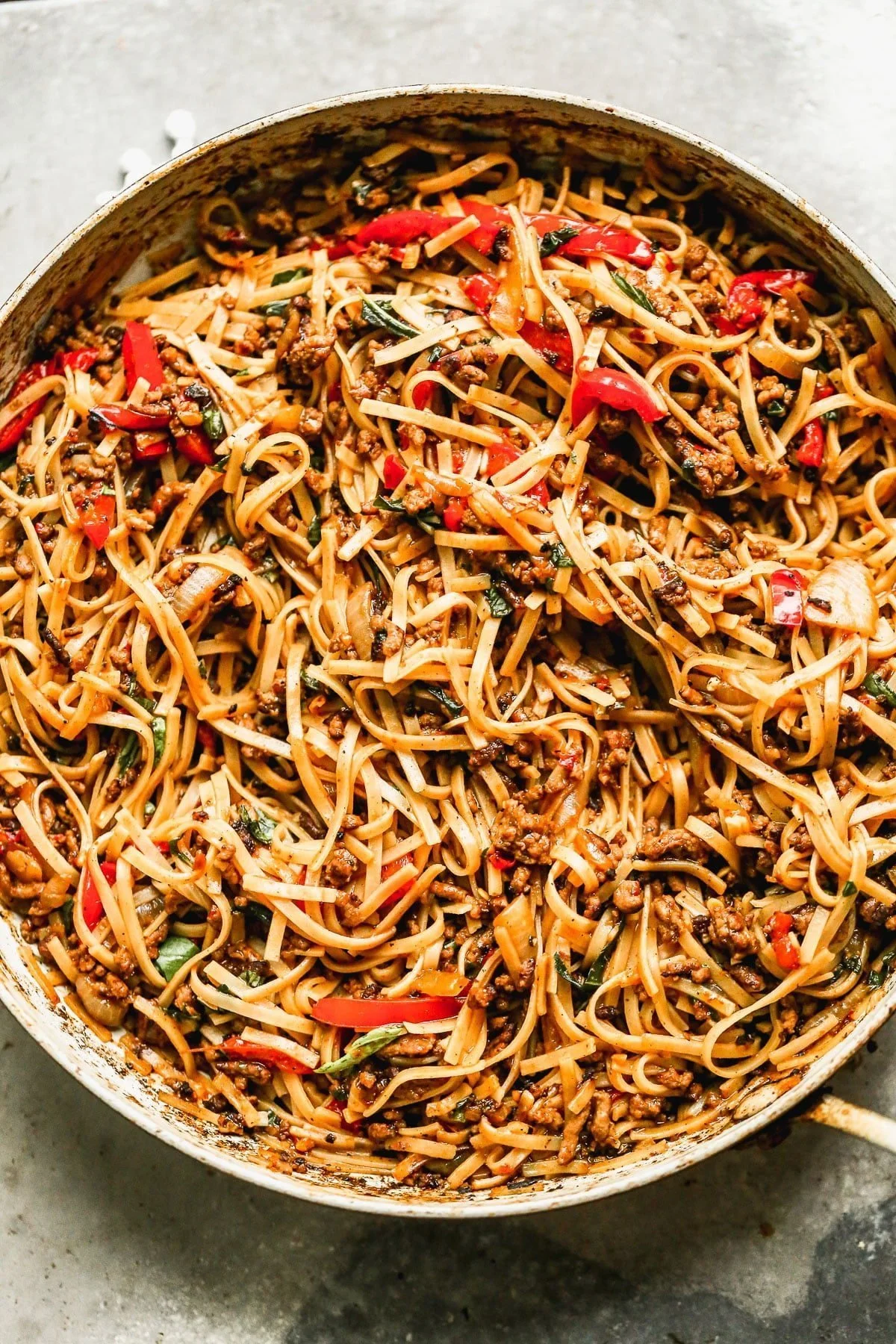 Brimming with saucy ground beef, chewy rice noodles, and plenty of veggies, our Spicy Beef Noodles are the perfect way to get dinner on the table fast and without complaint. These guys are equal parts sweet, spicy, and delicious and we can't get enough of them. Perfect way to use up leftover ground beef and veggies.