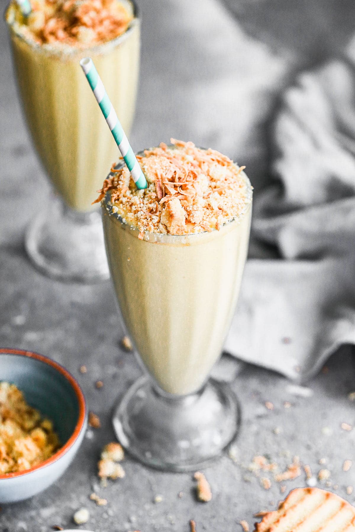 We're celebrating Oster's 75th Blending Anniversary with a Tropical Smoothie worthy of any special occasion. Filled with all your favorite tropical flavors - pineapple, mango, and coconut - this easy-to-throw-together smoothie turned dessert is irresistibly sweet, brimming with beach vibes and here to party. We top each ultra smooth, cold smoothie with toasted coconut and crushed shortbread cookies for the perfect play on texture. Don't miss this one!&nbsp;
