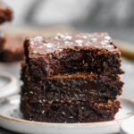 Salted Double Chocolate Brownies are moist, gooey, and what chocolate dreams are made of. We use both cocoa powder and high-quality baking chocolate to achieve a sinfully chocolatey brownie you'll come back to time and time. Nutty brown butter is the base, adding another layer of flavor while a heavy hand of flaked Maldon salt gives these a wonderfully sweet and salty finish. Trust me, you don't want to miss these! 