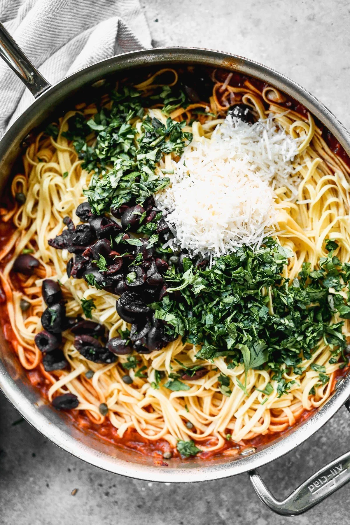 Linguine with parmesan, capers, olives, and parmesan cheese