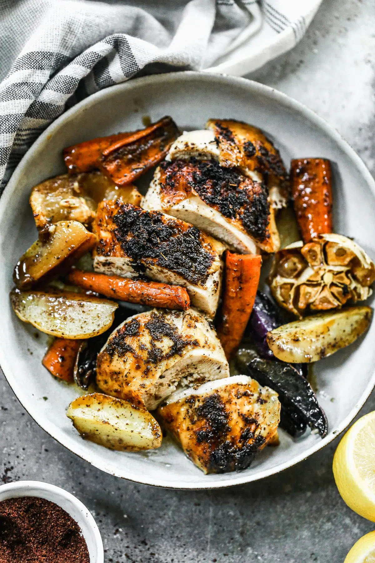 With a crispy sumac and garlic crusted skin and a juicy lemon-kissed interior, our Cast Iron Roast Chicken is not only perfectly delicious but the perfect fall dinner. Alongside the chicken, we scatter fingerling potatoes and whole carrots to sop up every bit of salty juice that drips to the bottom of the pan.