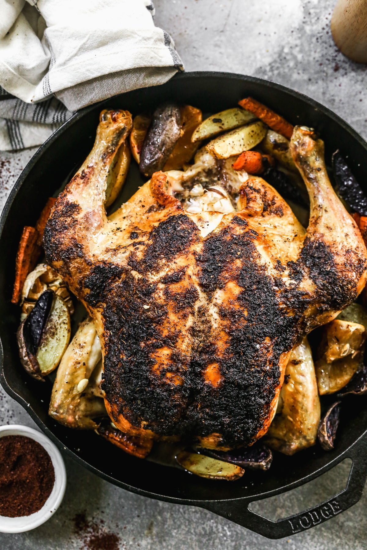 With a crispy sumac and garlic crusted skin and a juicy lemon-kissed interior, our Cast Iron Roast Chicken is not only perfectly delicious but the perfect fall dinner. Alongside the chicken, we scatter fingerling potatoes and whole carrots to sop up every bit of salty juice that drips to the bottom of the pan.