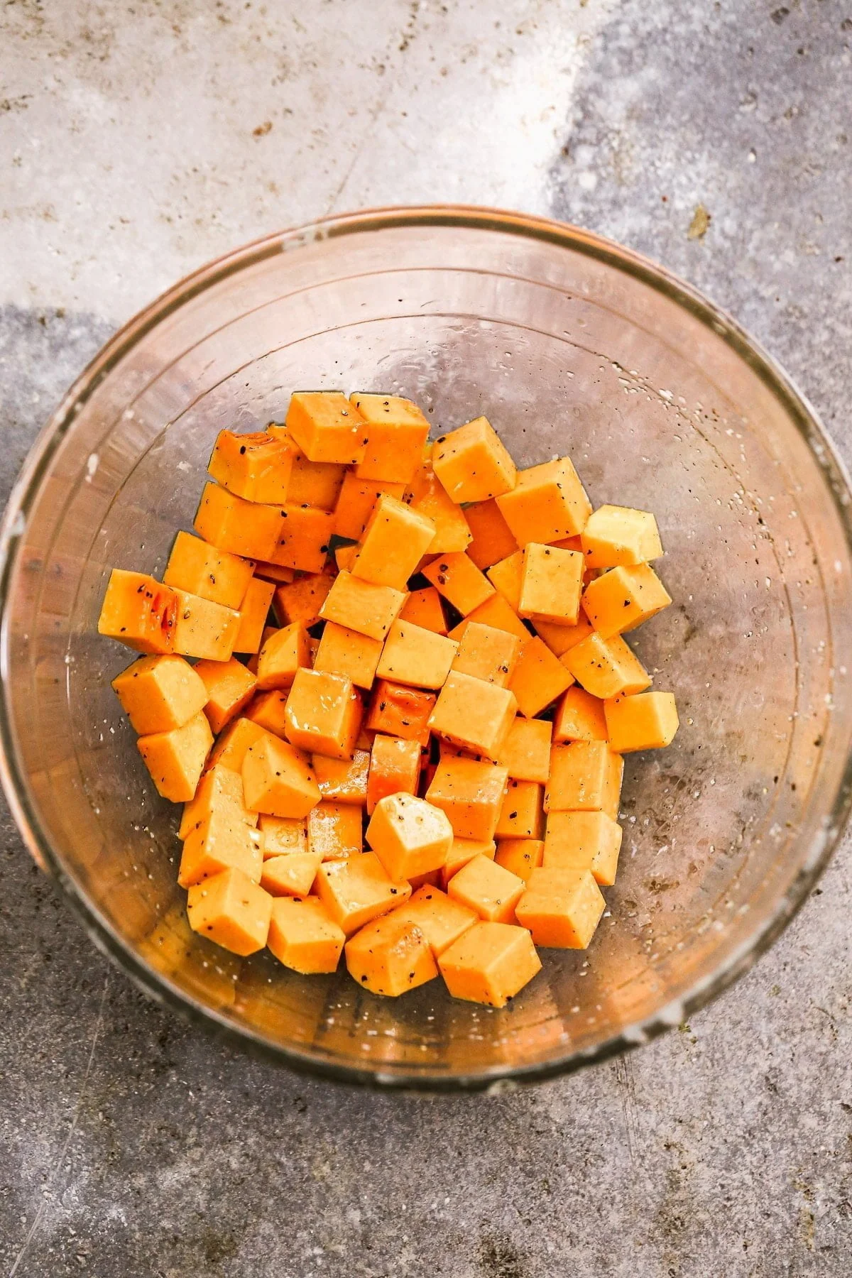 Diced butternut squash tossed in olive oil, salt and pepper
