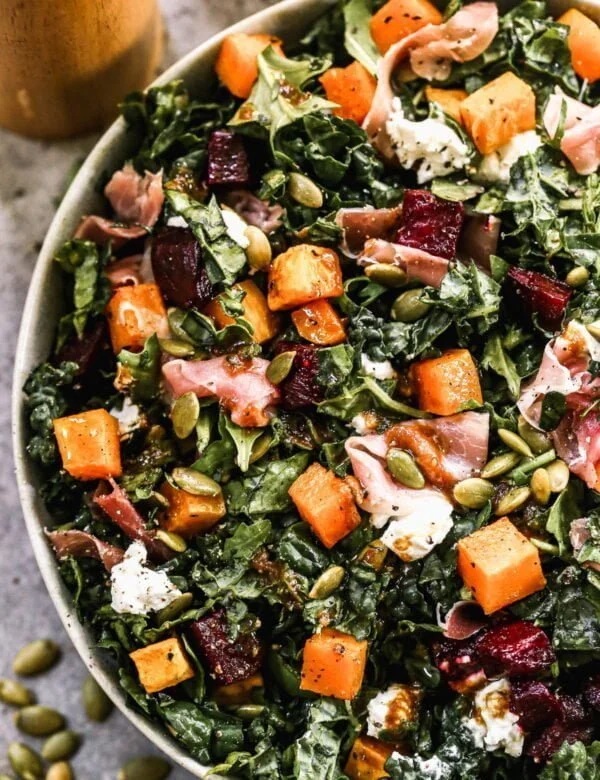 If you pick one salad to make on repeat this fall, let it be our Roasted Butternut Squash Salad. This fall-forward salad is packed with roasted butternut squash and beets, speckled with creamy goat cheese, crunchy pepita seeds and hand-torn pieces of salty prosciutto. We toss everything in a sweet and savory pumpkin vinaigrette and dig in.