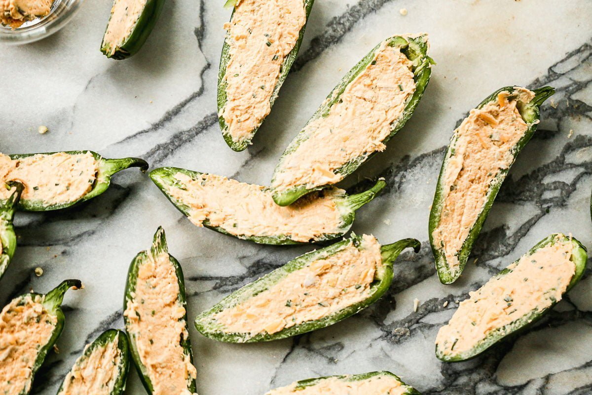 Game Day grub doesn't get more quintessential than jalapeño poppers and buffalo chicken, but when you combine the two in our Air Fryer Jalapeño Poppers? Finger food nirvana.