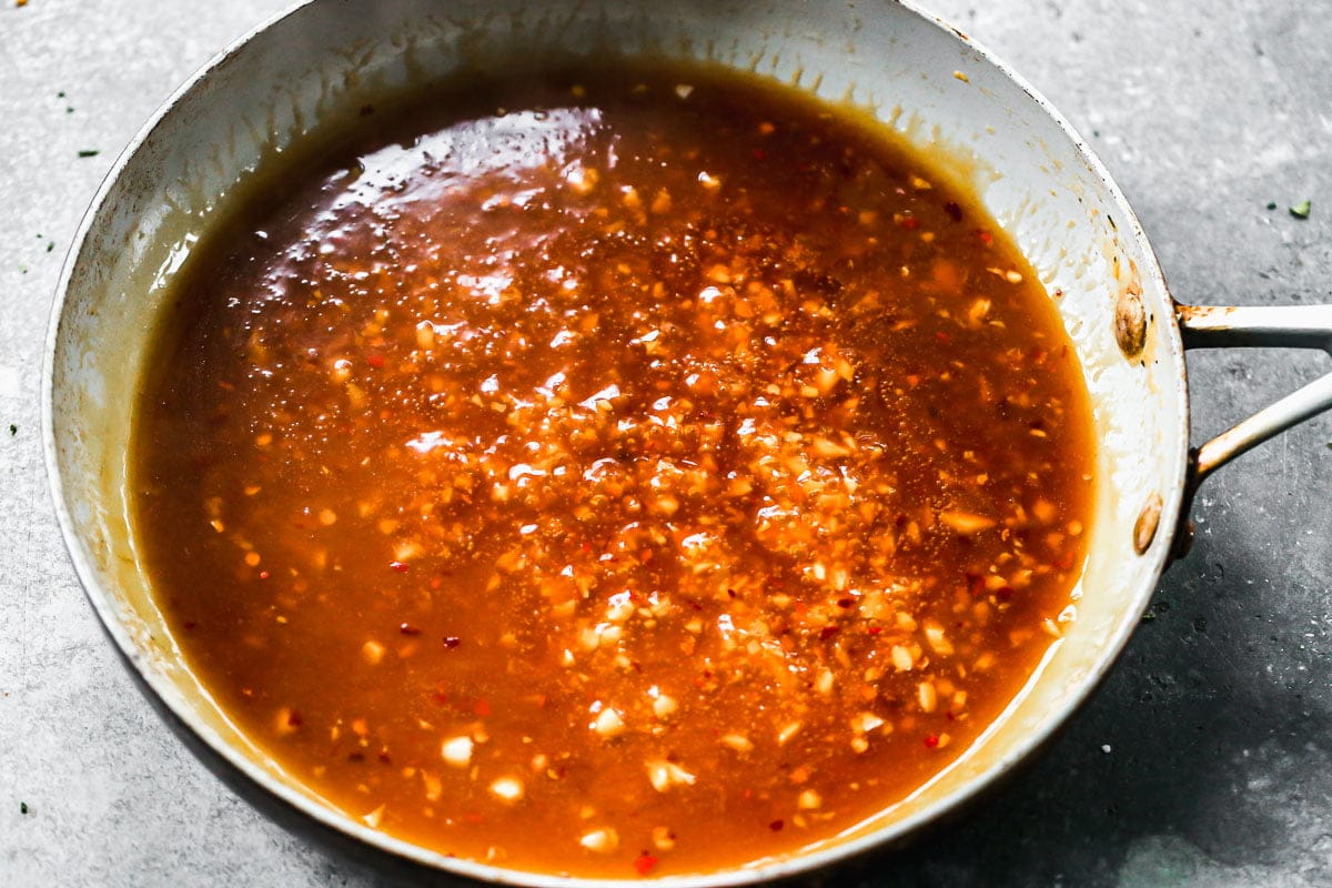 Orange chicken sauce simmering