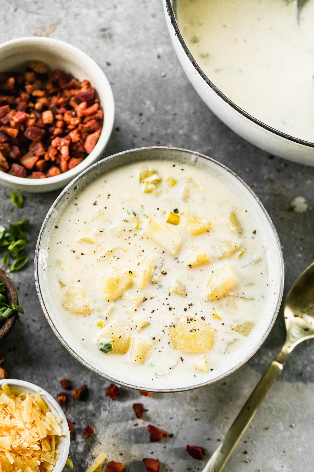 With many of the same notes as the classic, Cheesy Potato Soup is basically an elevated version of classic baked potato soup but BETTER. We swap out cheddar for aged gouda, throw in sweet leeks, tangy crème fraîche and salty pancetta for an updated version we're obsessed with.