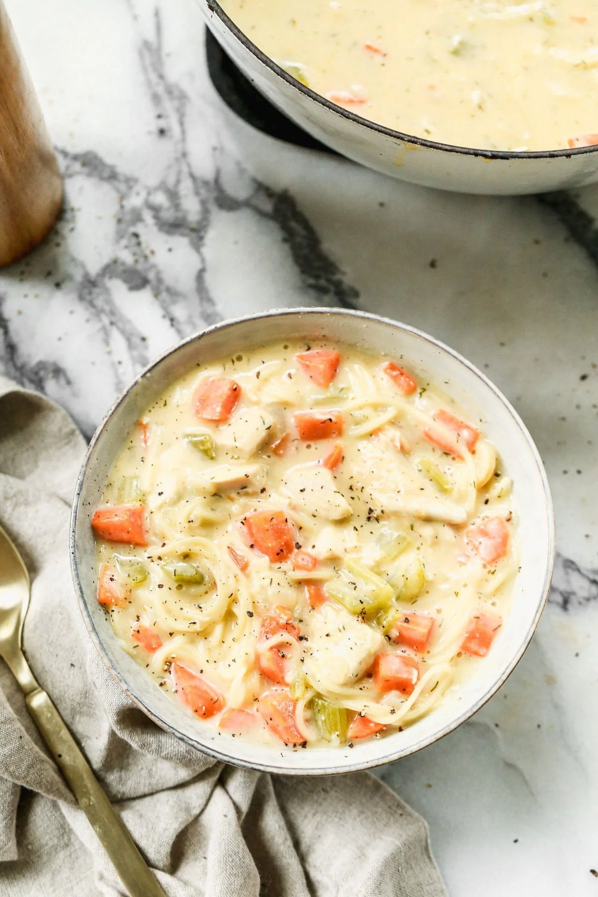 Crack Chicken Noodle Soup is cheesy, full of tangy ranch-inspired flavor and swirled with slurp-worthy angel hair pasta. Definitely not your typical bowl of chicken and noodles. 