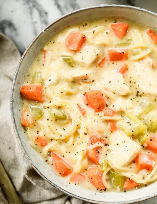 Crack Chicken Noodle Soup is cheesy, full of tangy ranch-inspired flavor and swirled with slurp-worthy angel hair pasta. Definitely not your typical bowl of chicken and noodles.