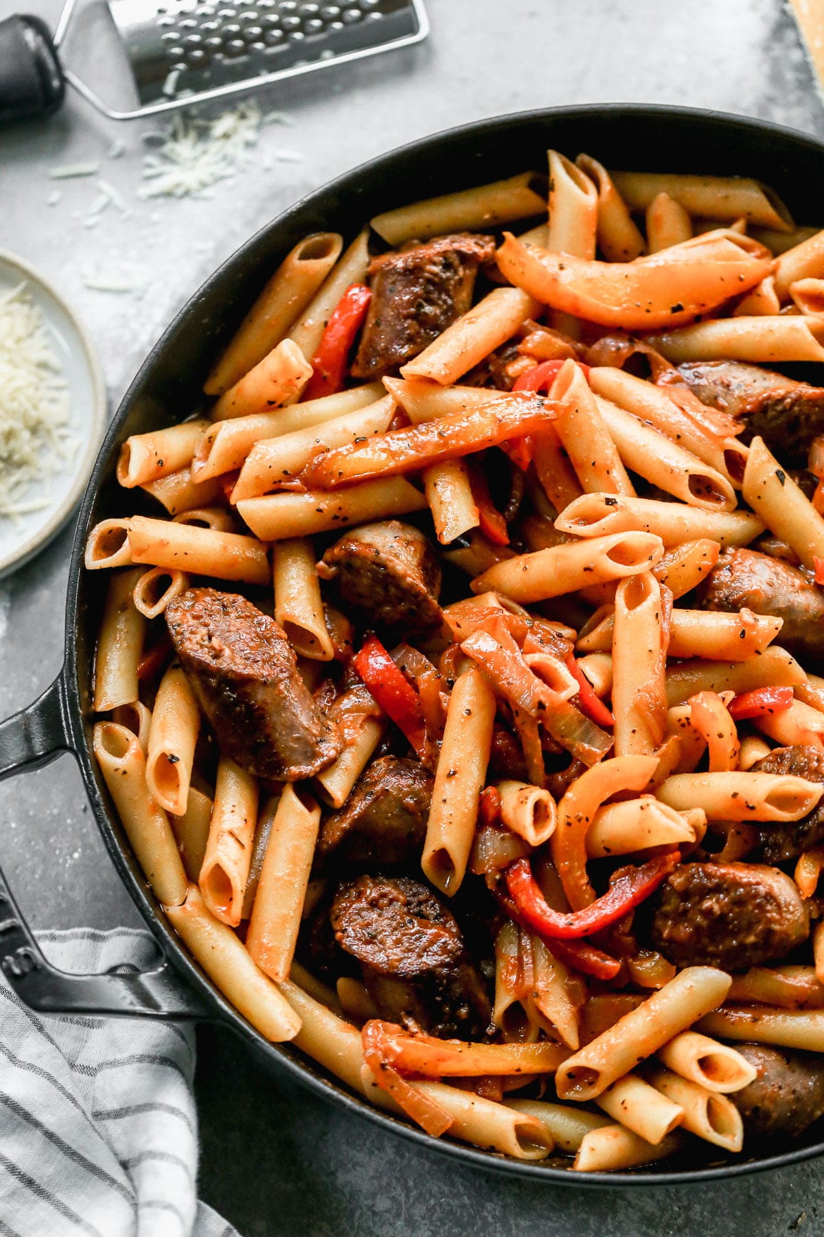 Rather simple and admittedly un-fancy, our Italian Sausage and Peppers Pasta doesn't have to be the most sophisticated gal on the block because what it IS, is delicious, quick-cooking and made with easy-to-find inexpensive &nbsp;ingredients.