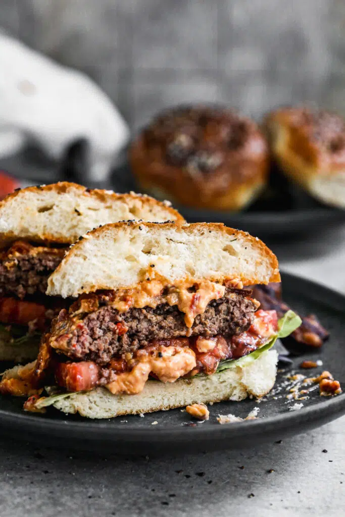 Our Pimento Cheeseburgers are the perfect way to gussy up your next backyard barbecue. We season all-beef patties simply with salt, pepper and Worcestershire sauce grill them and then generously smother them with homemade pimento cheese, crispy bacon, lettuce and tomato, then sandwich it between at buttery &quot;everything&quot; brioche bun. Simple and so delicious. 