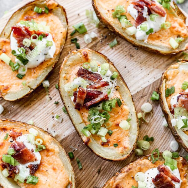 Air Fryer Potato Skins Stuffed with gooey pimento cheese, creme fraiche, crispy bacon and a sprinnkling of chives.