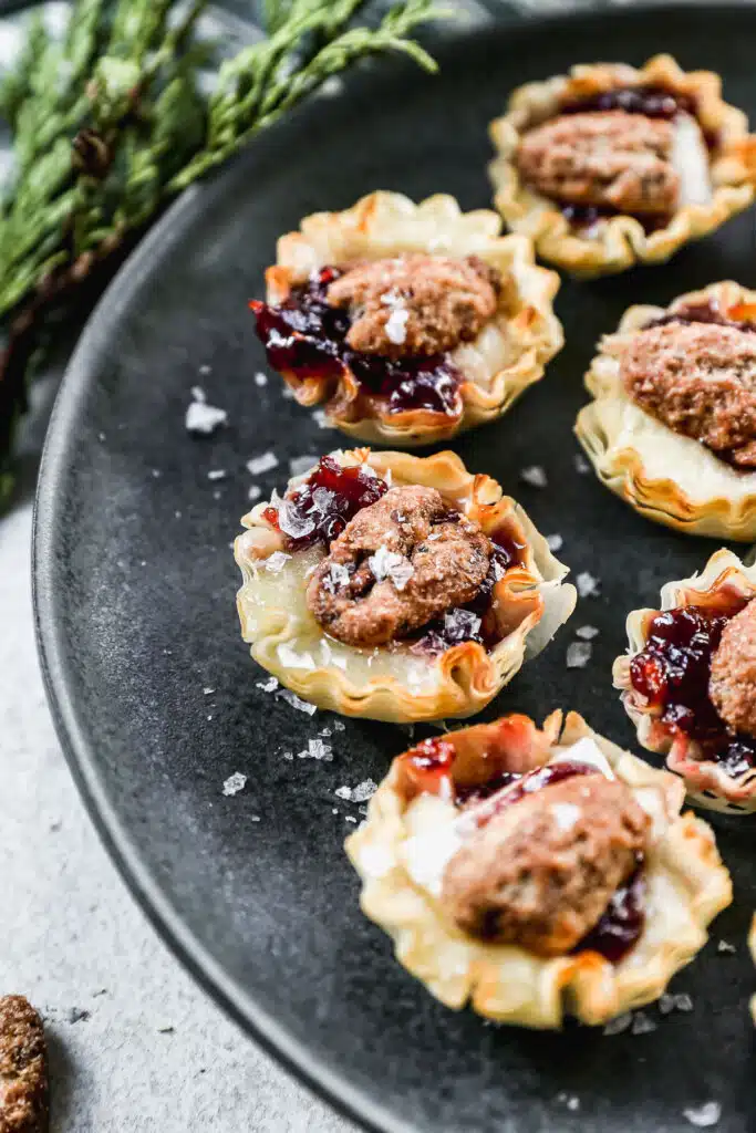 Brimming with melty brie, sweet jam and topped with a crunchy candied pecan, our brie bites will be the hit of any party!