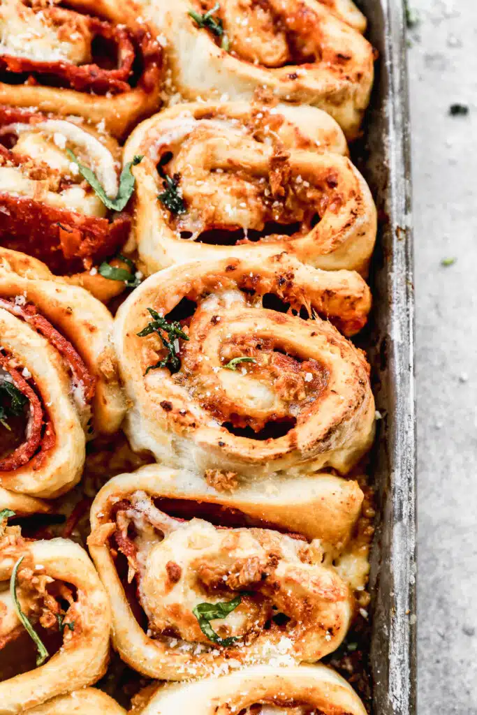 Our Pepperoni Roll recipe is the ultimate pizza snack! Layers of pillow-y dough, pizza sauce, pepperoni and gooey cheese all topped off with garlic butter.