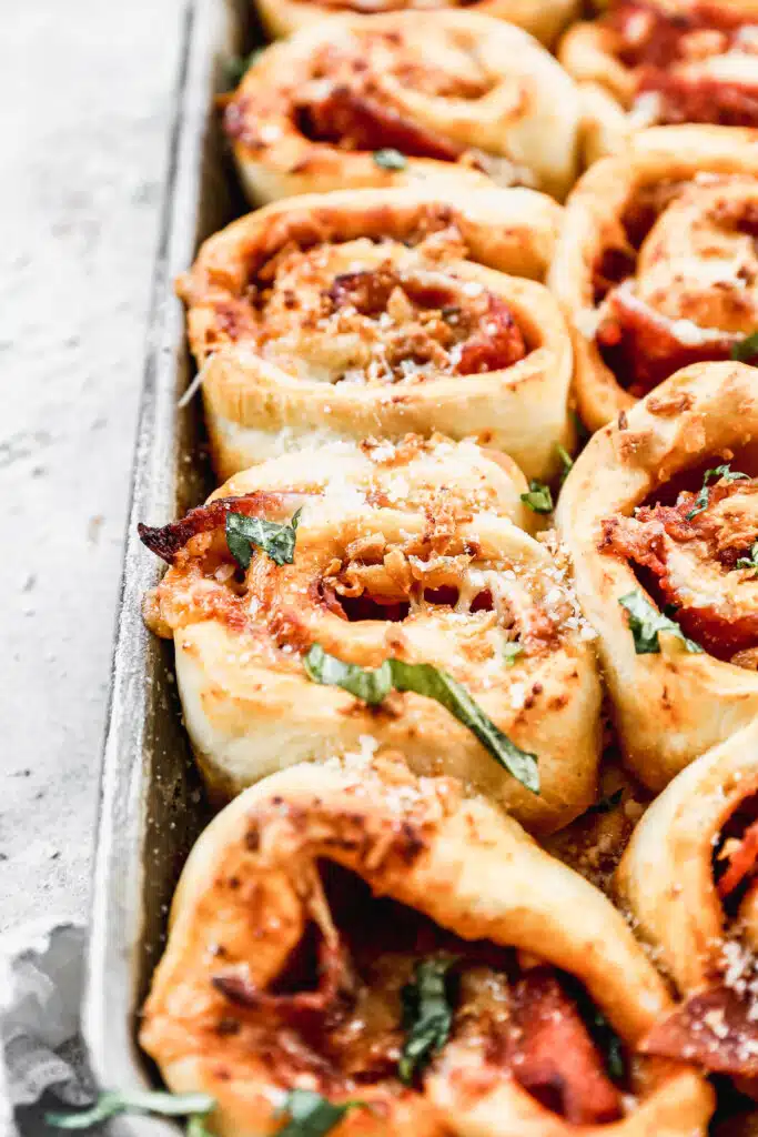 Our Pepperoni Roll recipe is the ultimate pizza snack! Layers of pillow-y dough, pizza sauce, pepperoni and gooey cheese all topped off with garlic butter.