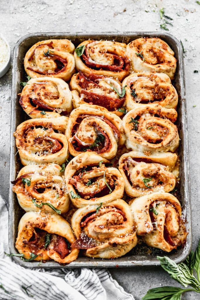 Our Pepperoni Roll recipe is the ultimate pizza snack! Layers of pillow-y dough, pizza sauce, pepperoni and gooey cheese all topped off with garlic butter.