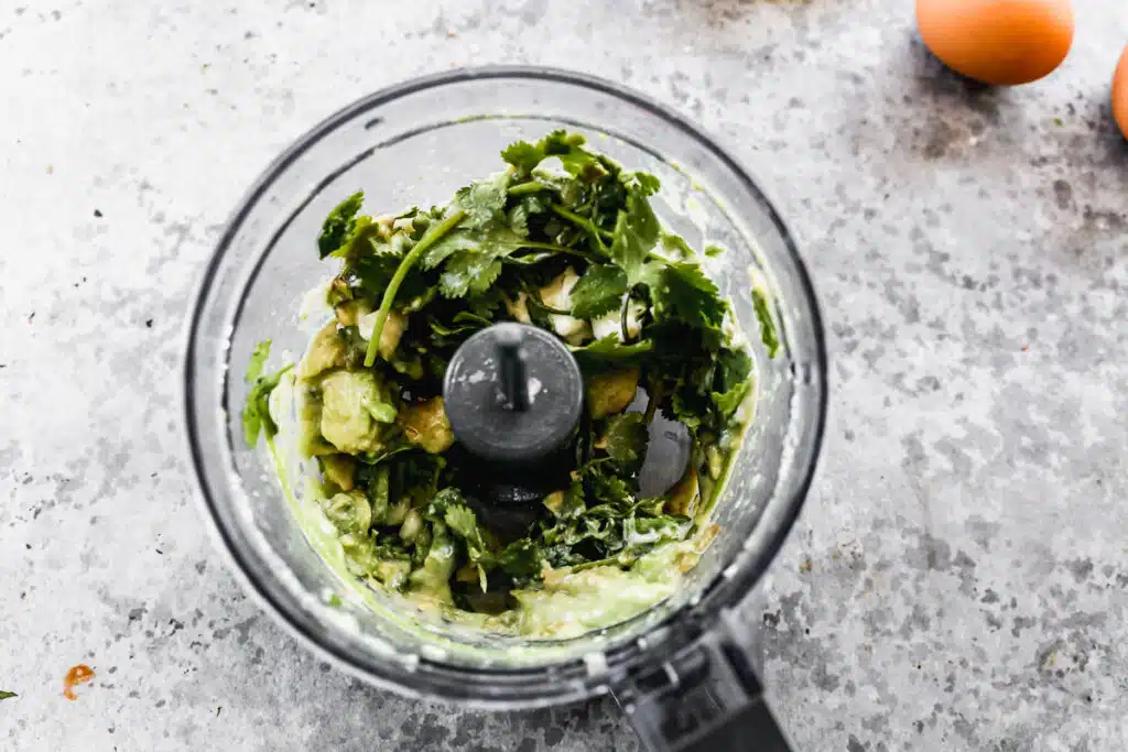 Cilantro, jalapeno, avocado, greek yogurt, garlic, lime juice, salt and pepper in a mini blender.