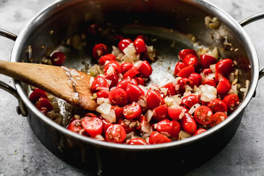 Cherry tomatoes sautéed with onion and garlic.