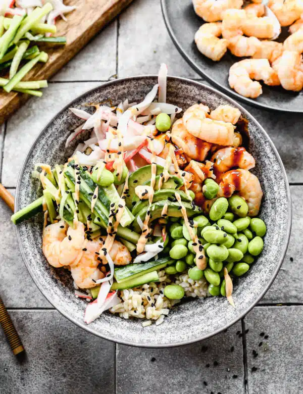 Packed with fiber-packed brown rice and piled high with plump sautéed shrimp, sweet imitation crab and plenty of veggies, our Shrimp Poke Bowl will satisfy your sushi cravings right at home. And because no sushi roll is complete without a little sauce, we drizzle each bowl with a sweet soy glaze and an impossibly easy spicy mayo you'll want to put on everything