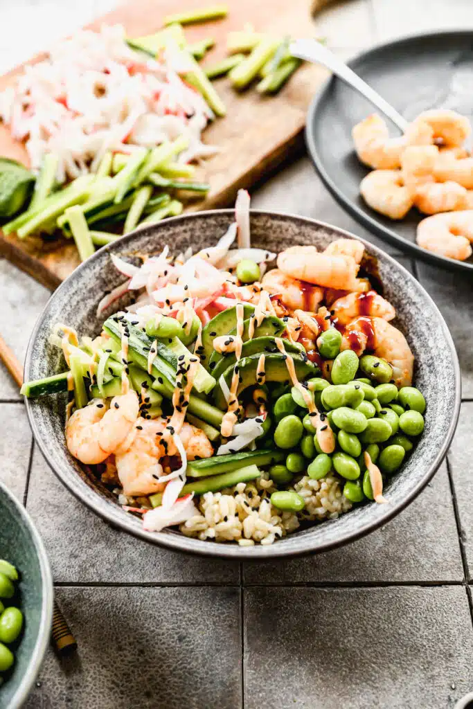 Packed with fiber-packed brown rice and piled high with plump sautéed shrimp, sweet imitation crab and plenty of veggies, our Shrimp Poke Bowl will satisfy your sushi cravings right at home. And because no sushi roll is complete without a little sauce, we drizzle each bowl with a sweet soy glaze and an impossibly easy spicy mayo you'll want to put on everything