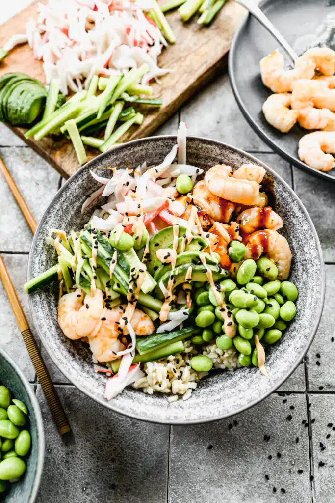 Packed with fiber-packed brown rice and piled high with plump sautéed shrimp, sweet imitation crab and plenty of veggies, our Shrimp Poke Bowl will satisfy your sushi cravings right at home. And because no sushi roll is complete without a little sauce, we drizzle each bowl with a sweet soy glaze and an impossibly easy spicy mayo you'll want to put on everything