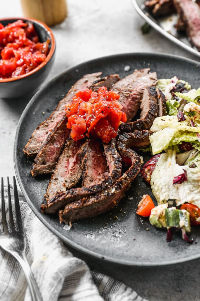 If you’re looking for a go-to Marinated Flank Steak recipe for summer grilling, then obviously, you’ve come to the right place. Using pantry staples such as punchy balsamic vinegar, hints of sweet brown sugar, garlic and tangy dijon, also make this an easy fuss-free recipe you’ll keep for years to come.