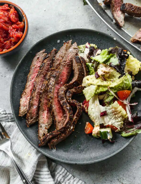 If you’re looking for a go-to Marinated Flank Steak recipe for summer grilling, then obviously, you’ve come to the right place. Using pantry staples such as punchy balsamic vinegar, hints of sweet brown sugar, garlic and tangy dijon, also make this an easy fuss-free recipe you’ll keep for years to come.