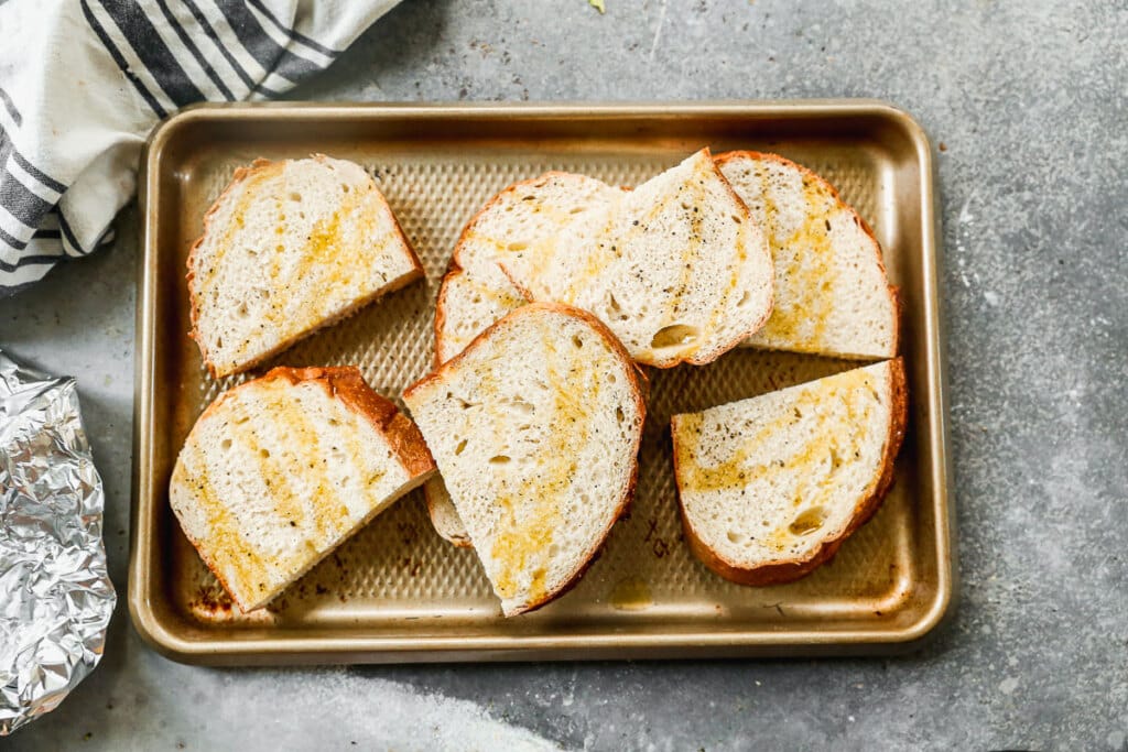 Sourdough bread drizzled with olive oil.