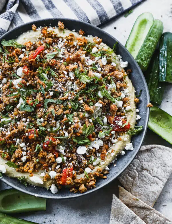 Layered with store-bought hummus, a mediterranean-spiced ground chicken mixture, feta and mint then topped with hot honey, this Loaded Hummus in the new way to crudités.