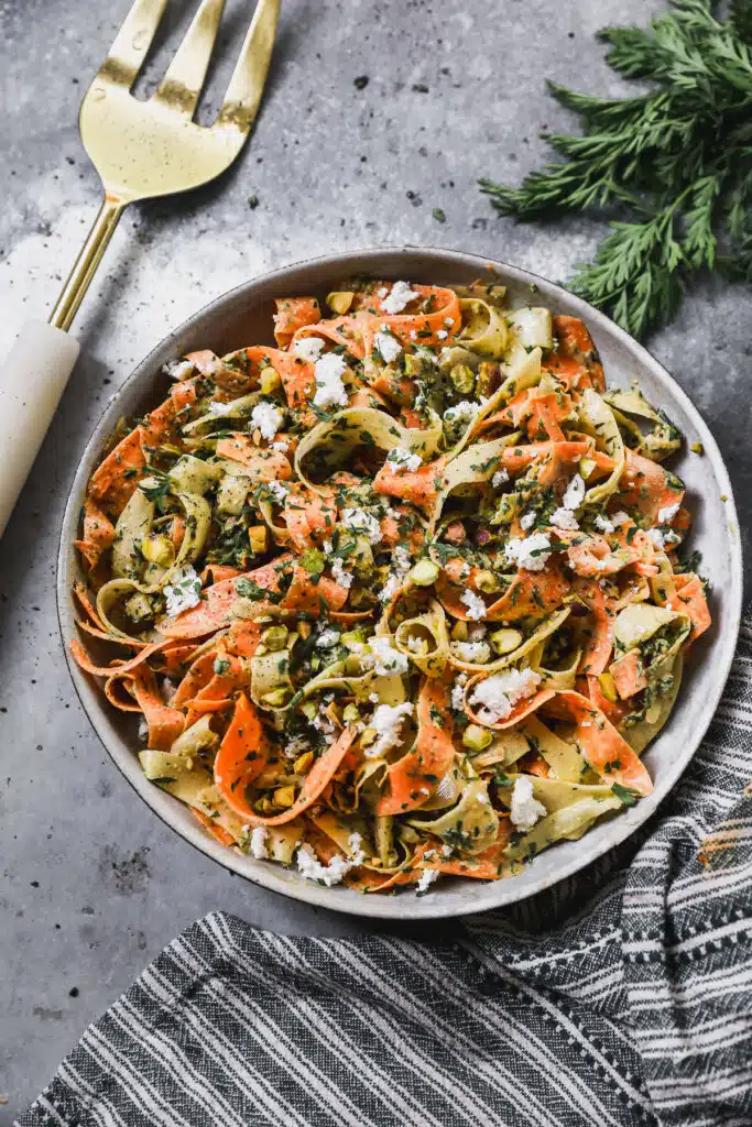 Buttery pistachio and mint pesto, creamy goat cheese and paper-thin shaved carrots are the makings of our new favorite way to do summer veggies - a Raw Carrot Salad. We are simply obsessed with this crunchy, herbaceous, tangy totally delightful side dish.