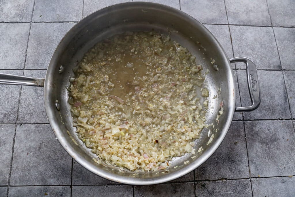 Shallots, garlic and white wine in a large skillet