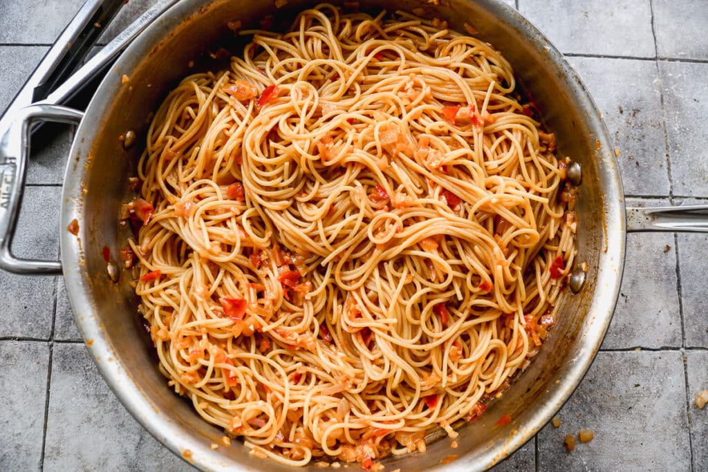 Spaghetti with Calabrian chili sauce in a large skillet