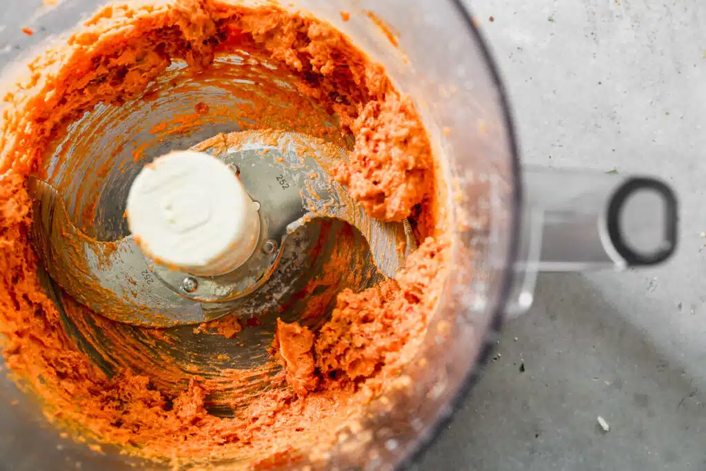 Sun-dried tomato and parmesan butter in a food processor