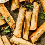 Taco-flavored ground beef and melty cheddar cheese stuffed in corn tortillas and baked into a crunchy, cheesy snack nirvana. The perfect quick and easy dinner or after school all without the fuss of frying.