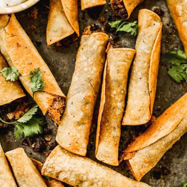 Taco-flavored ground beef and melty cheddar cheese stuffed in corn tortillas and baked into a crunchy, cheesy snack nirvana. The perfect quick and easy dinner or after school all without the fuss of frying.