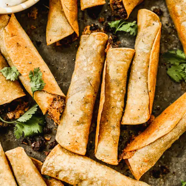 Taco-flavored ground beef and melty cheddar cheese stuffed in corn tortillas and baked into a crunchy, cheesy snack nirvana. The perfect quick and easy dinner or after school all without the fuss of frying.