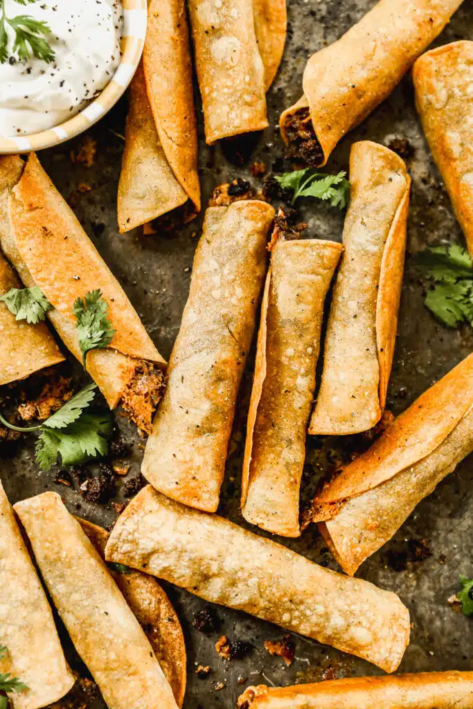 Taco-flavored ground beef and melty cheddar cheese stuffed in corn tortillas and baked into a crunchy, cheesy snack nirvana. The perfect quick and easy dinner or after school all without the fuss of frying.