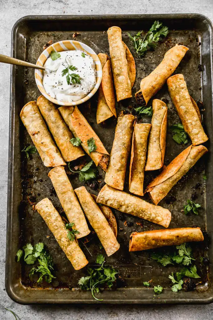 Taco-flavored ground beef and melty cheddar cheese stuffed in corn tortillas and baked into a crunchy, cheesy snack nirvana. The perfect quick and easy dinner or after school all without the fuss of frying.