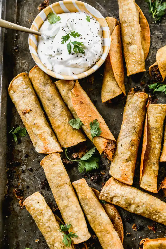 Taco-flavored ground beef and melty cheddar cheese stuffed in corn tortillas and baked into a crunchy, cheesy snack nirvana. The perfect quick and easy dinner or after school all without the fuss of frying.