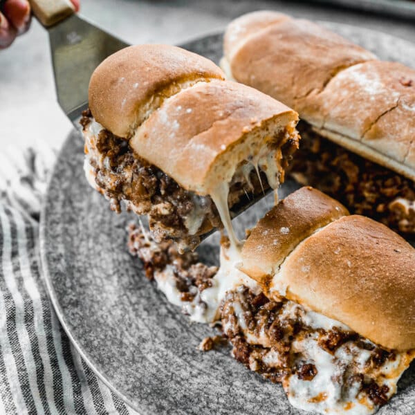 Stuffed to the brim with a hearty meat filling and then slathered with a gooey, cheesy mozzarella and ricotta mixture, this Lasagna Sandwich is your quick fix to a lasagna craving without all the fuss.