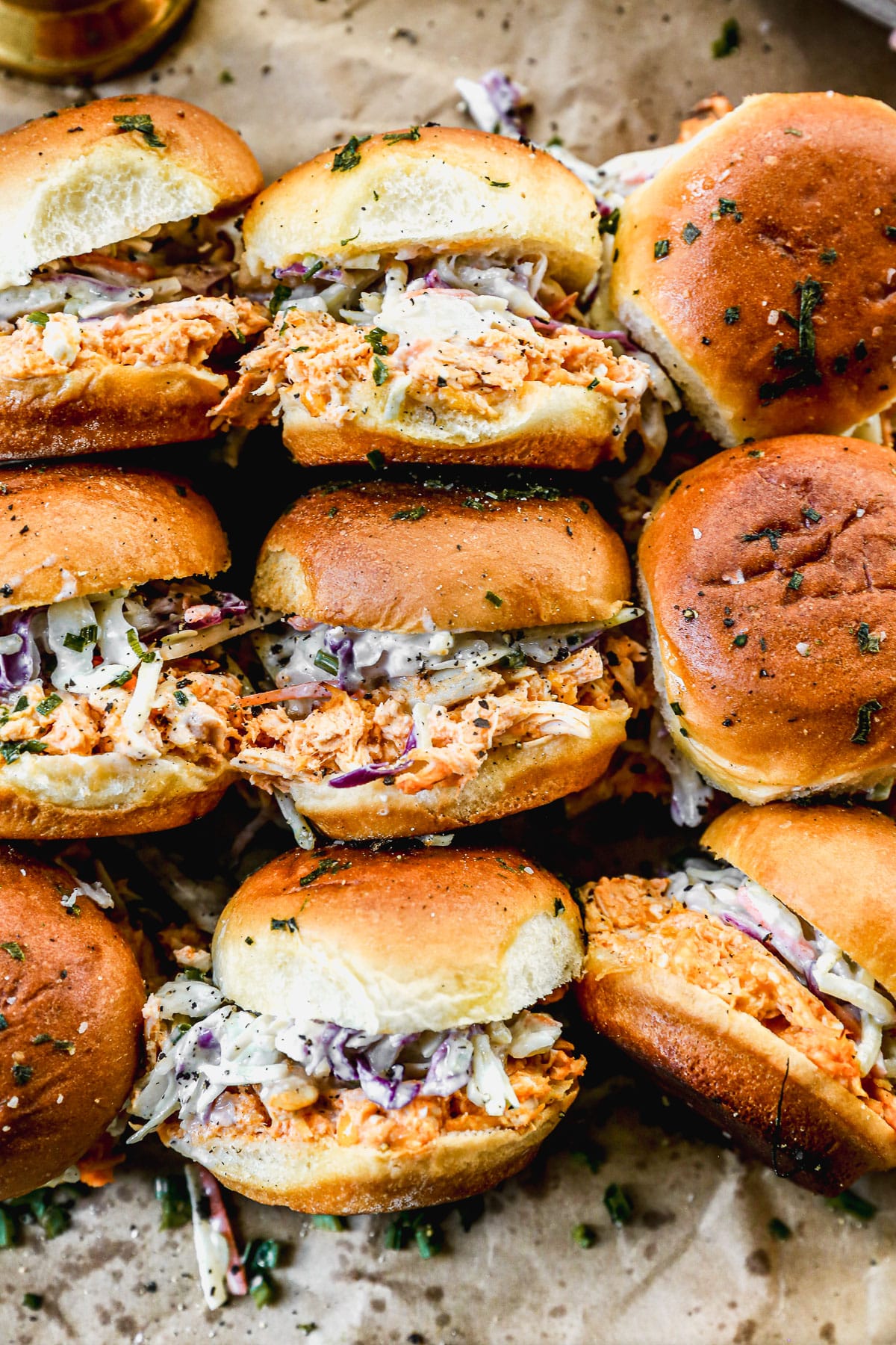 Buffalo chicken sliders on a baking sheet